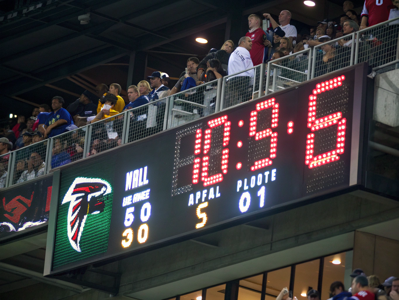 Neon red scoreboard displaying final match results