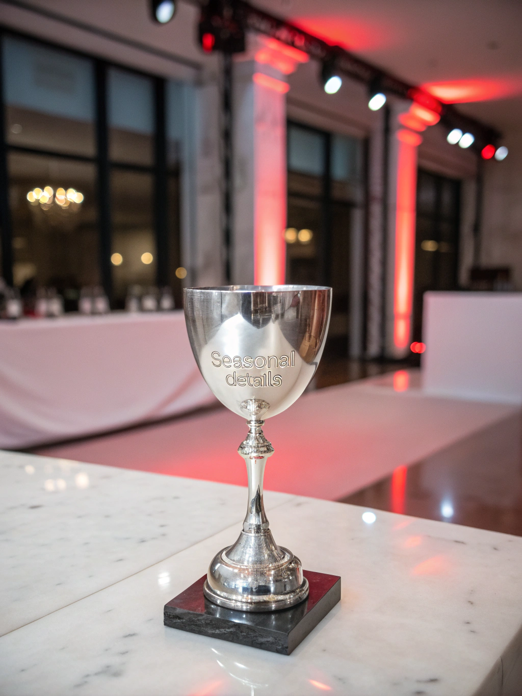 Close-up of the championship trophy with red reflections